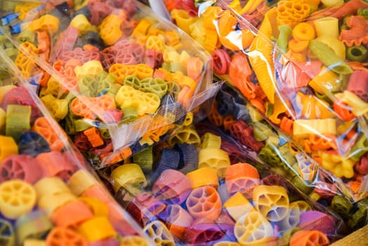 colored pasta in transparent packages