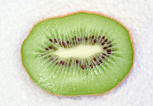 slice kiwi fruit close up on white background