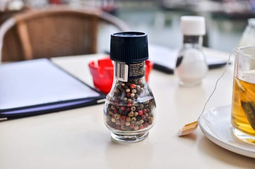 four seasonal peppers in a small glass jar