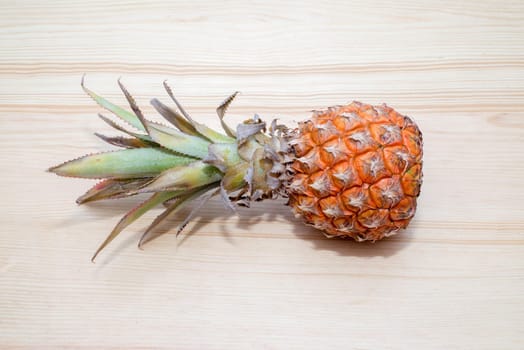 the fresh pineapple on the wooden table