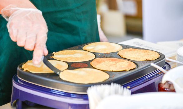 Making Pancakes on a hot griddle