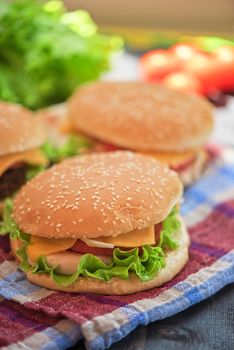Closeup of home made burgers on wooden table