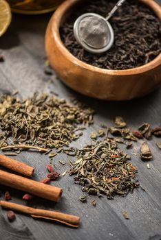 tea composition with cinnamon sticks, lemons