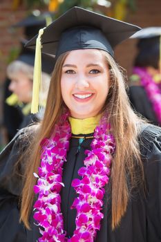 Smiling single female college student outdoors with boa