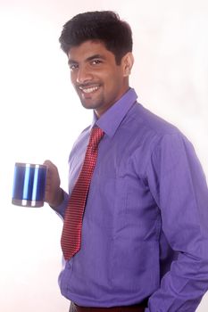 happy businessman drinking coffee in office