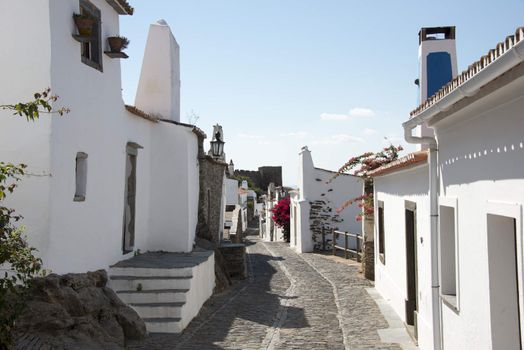 street with white houses monsaraz in alentejo portugal