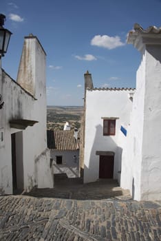street with white houses monsaraz in alentejo portugal