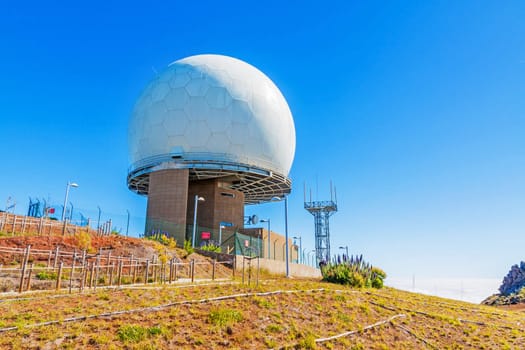 Madeira, Portugal - June 6, 2013: Pico do Arieiro, the 3rd highest mountain of Madeira, Portugal with impressive radar station globe.