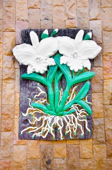 Low relief cement flower Thai style handcraft.