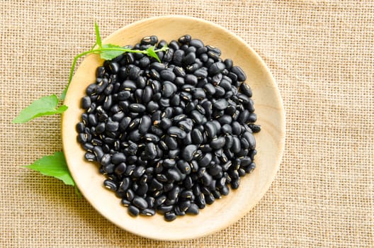 Black Eyed Peas and leaf on sack background