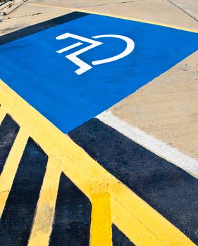 Disabled parking sign on the floor.