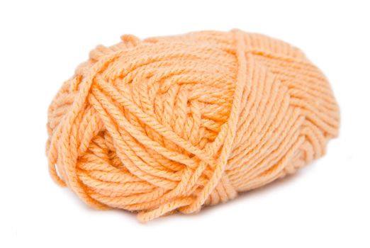 orange yarn on white background.