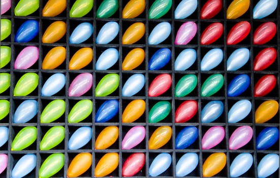 Many colorful balloons in block wood wall.