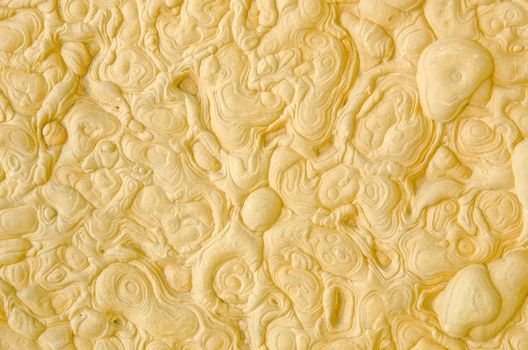Surface of yellow stone background