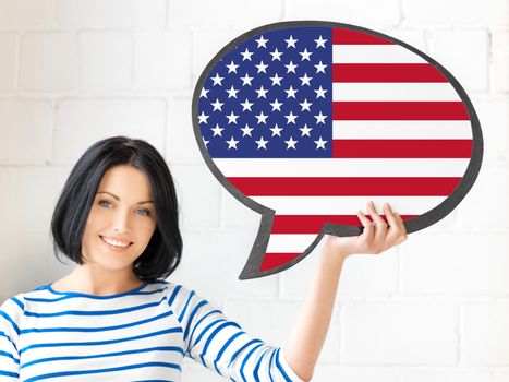 education, foreign language, english, people and communication concept - smiling woman holding text bubble of american flag