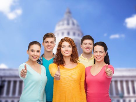 friendship, tourism, travel and people concept - group of smiling teenagers standing over white house background