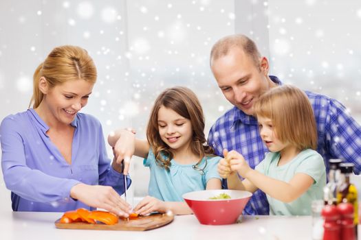 food, family, children, happiness and people concept - happy family with two kids making dinner at home