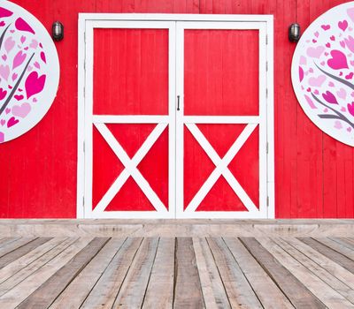 red door and wood bridge
