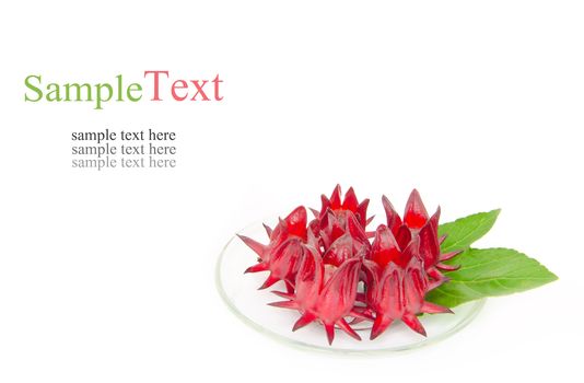 Close up of roselle on glass plate on white background