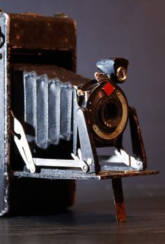 Closeup of old film camera on dark background