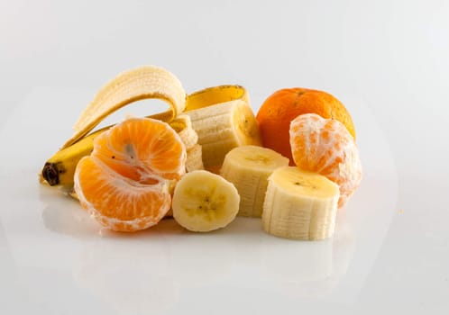 Banana and tangerine isolater on white background