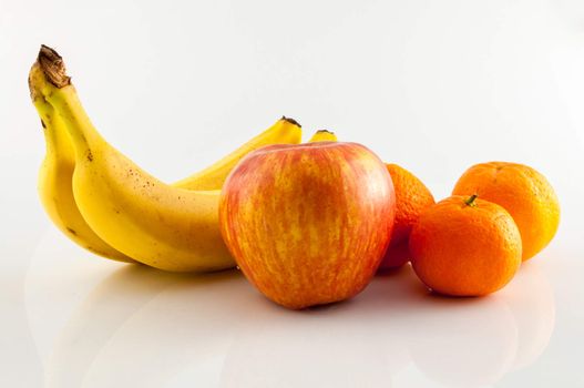 Banana, apple and tangerine isolated