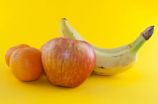 Banana, apple and tangerine isolated