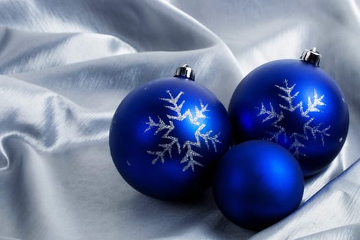 Christmas blue balls on a silver background