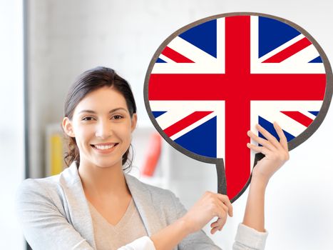 education, foreign language, english, people and communication concept - smiling woman holding text bubble of british flag