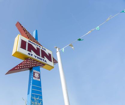 Vinita, USA - September 7, 2015; Retro neon arrow shape sign on Route 66, Inn at Vinita, Oklahoma, USA