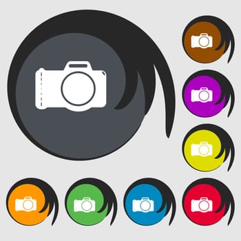 Photo camera sign icon. Digital photo camera symbol. Symbols on eight colored buttons. illustration