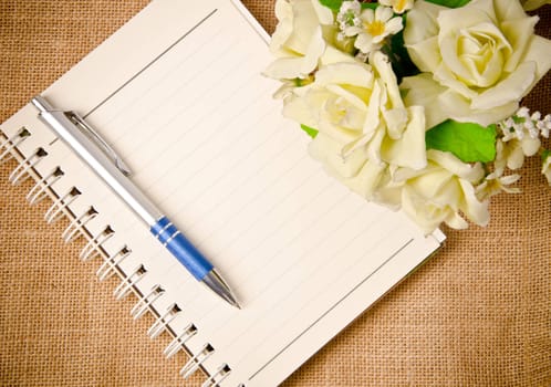 open diary ring binder on sack background.
