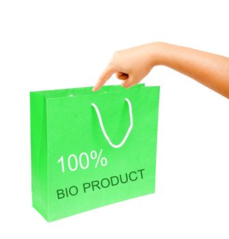 hand and blank green paper bag isolated on white background. 100% bio product