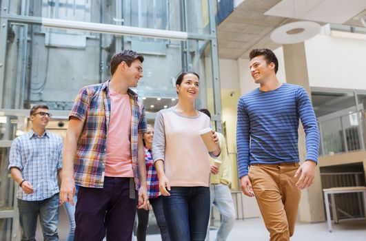 education, high school, friendship, drinks and people concept - group of smiling students with paper coffee cups