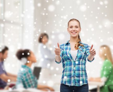 gesture, education, school and people concept - smiling student girl showing thumbs up over classroom and snow background