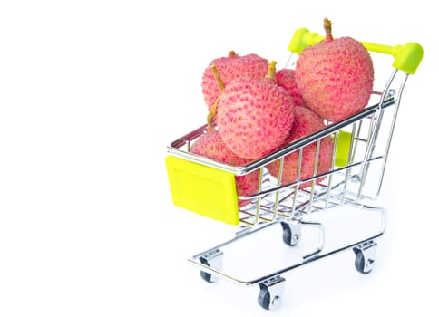 fresh lychees in shopping cart on white background