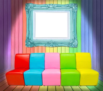 many color sofa and antique frame in colorful wood room background