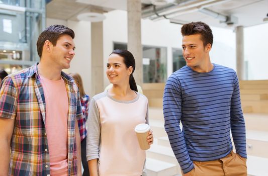 education, high school, friendship, drinks and people concept - group of smiling students with paper coffee cups