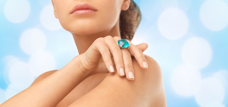 wedding, bridal jewelry and luxury concept - close up of beautiful woman hand with big blue cocktail ring