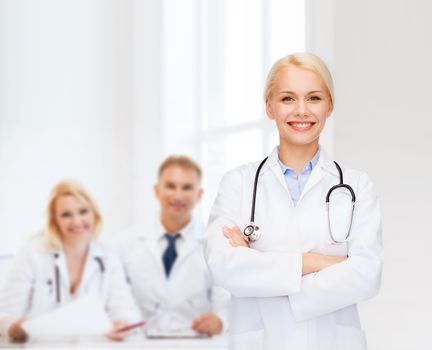 healthcare and medicine concept - smiling female doctor with stethoscope