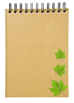 leaves on ring binder brown book or recycled paper notebook isolated on white background, clipping path