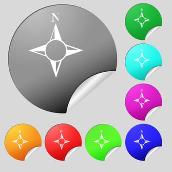 Compass sign icon. Windrose navigation symbol. Set of eight multi colored round buttons, stickers. illustration
