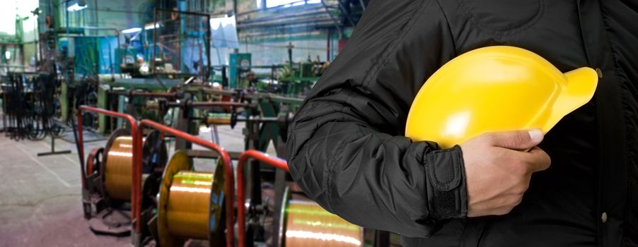 Worker with safety helmet at industrial factory