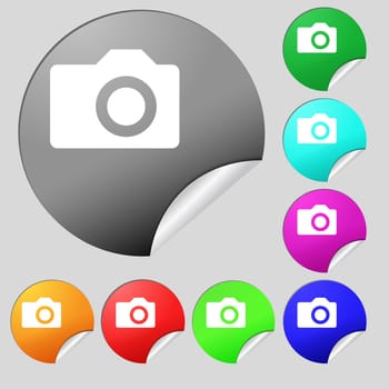 Digital photo camera icon sign. Set of eight multi-colored round buttons, stickers. illustration