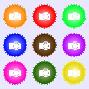 Photo camera sign icon. Digital photo camera symbol. A set of nine different colored labels. illustration
