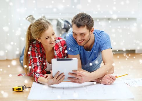 repair, building, renovation, technology and people concept - smiling couple with blueprint looking at tablet pc at home