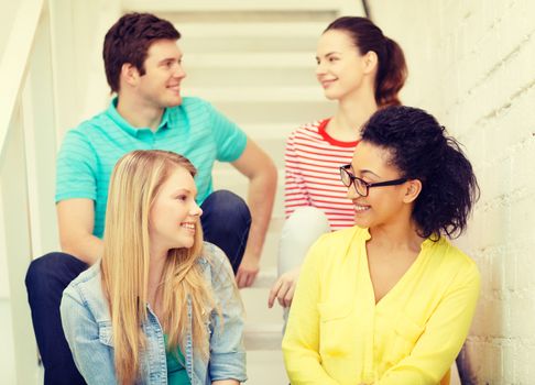 friendship and education concept - smiling teenagers hanging out