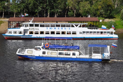 The boats "Tyumen-2" and "Admiral" on the Tura River in Tyumen, Russia.