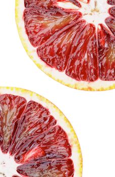 Two Slices of Ripe Blood Oranges isolated on White background