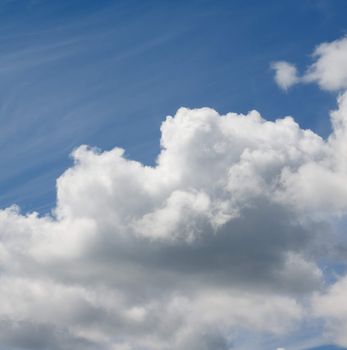 Fluffy Big White and Grey Cloud on Blue Sunny Sky Outdoors